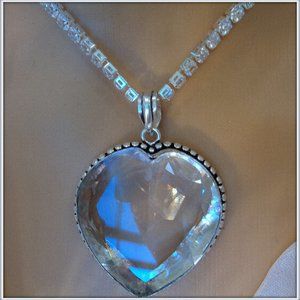 Simply stunning necklace features beautiful details with clear huge Gemstone